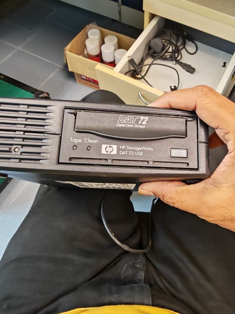 External DAT72 USB tape drive (backup tape drive) - HP StorageWorks DAT 72 USB; product number on label appears DW027A (blurry); regulatory model BRSLA-0501-AC (blurry)