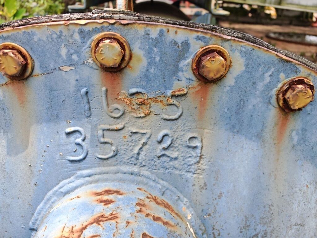Horizontal vessel with belt-driven vacuum pump on top - likely mud vacuum degasser (type TBC)
